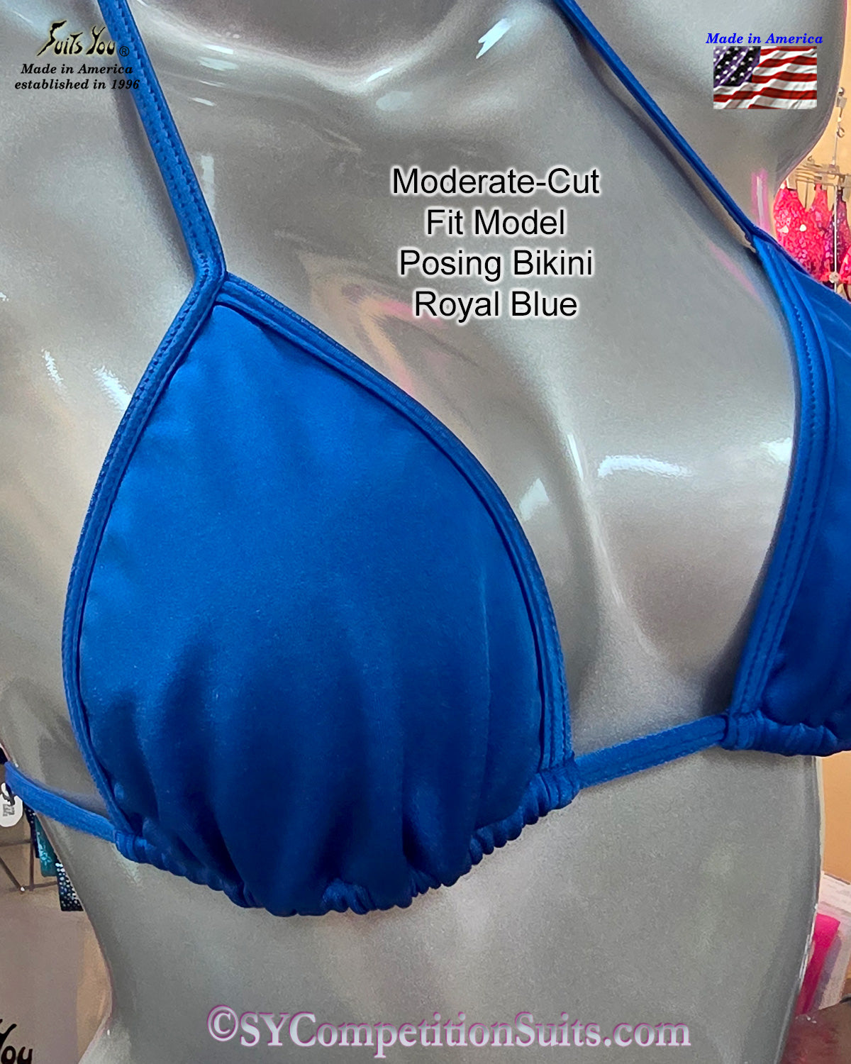 Adjustable slide sides and top construction on royal blue moderate cut Fit Model posing suit